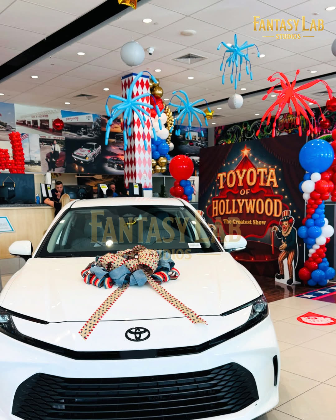 Showroom display: vehicle feature with branded backdrop by Fantasy Lab Studios
